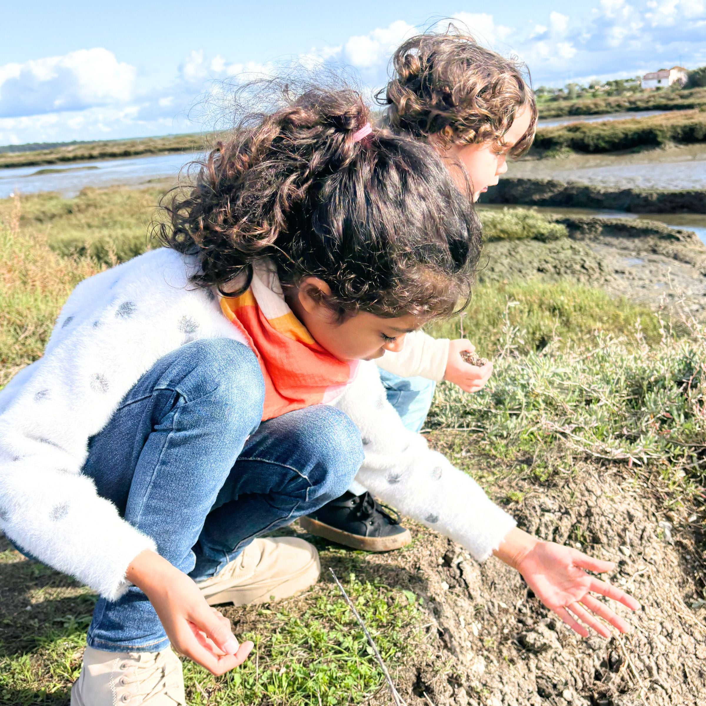 Kids playing in nature, girl wearing the golden indra bandana