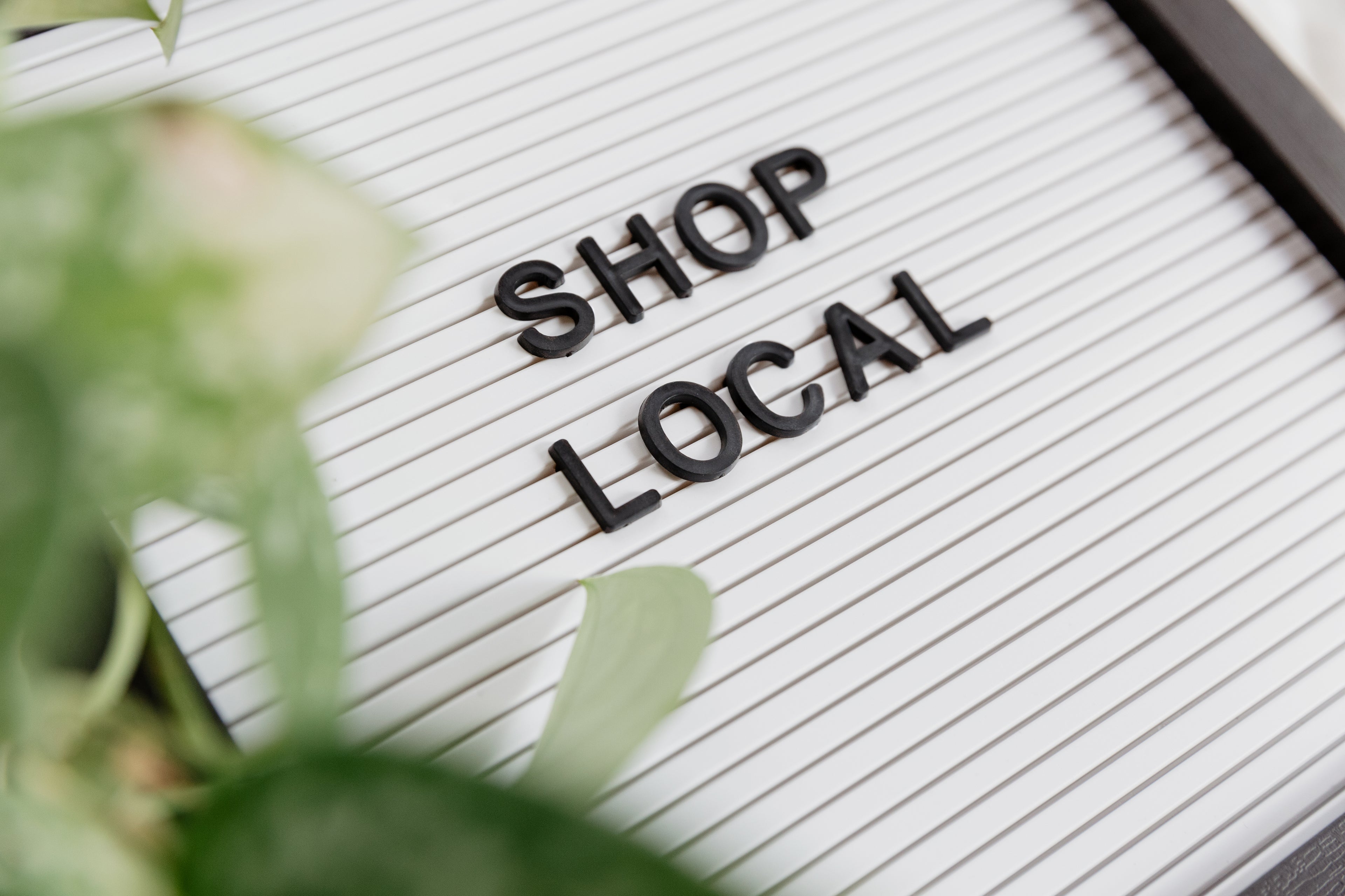 Sign with the words SHOP LOCAL