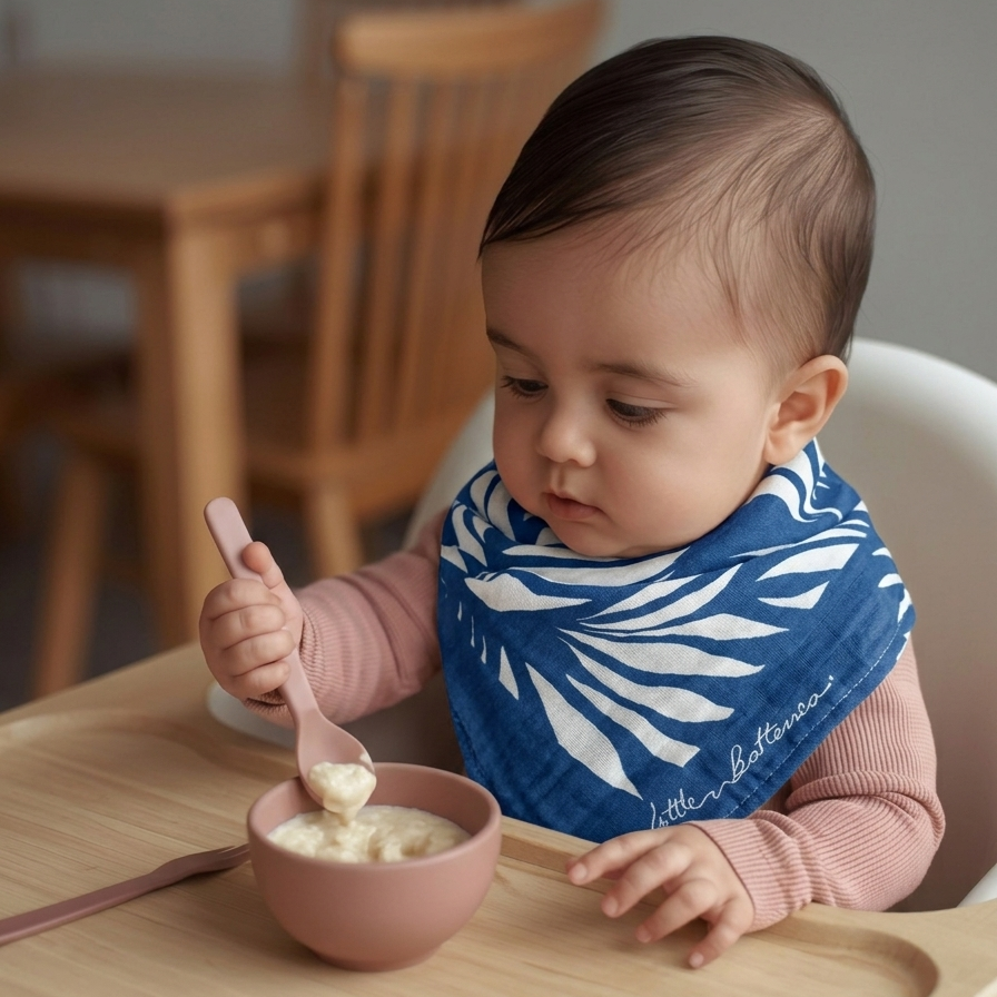 baby wearing small muslin cloth during feeding